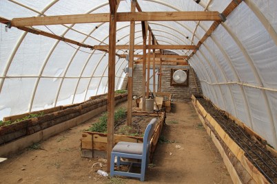 Greenhouse utilized by Not Forgotten Outreach, a veterans program. The raised beds are waist high in order to be accesible by wheel chair. Photo by Angelo Baca