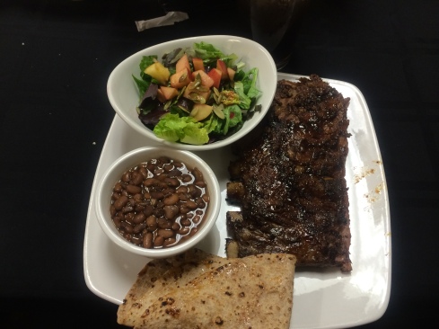 Delicious food from TOCAs Desert Rain Cafe. Prickly Pear glazed ribs, tepary beans, and salad with prickly pear dressing