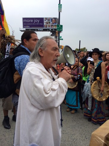 "I come from Greenland and my name is Anon-nuk. It means "the man who looks like his uncle." I don't know if you knew that, but the big ice is melting. Very badly. And its going to disappear. and this Manhattan will be underwater. Please sell your condominiums today, and move away from Manhattan. If you don't you will lose all your valuables. I know that people don't believe it, but the big ice was more than three miles thick when I was born. Now it's only a mile thick. and the water is in the ocean already. Its just that its very cold. But its warming up. And every degree it warms up, the water swells for more than 7 feet. We will be under water in a very short time. In my lifetime. So that's why i came to tell you. Its not enough to go on a march. we have to do something. We have to become the hope for the next generation. We have to give them hope. Before there is no land left in Manhattan or on the east coast of the United States. I hope the White House knows they're going to be on an island. So please know that I came here a long way to tell you that the big ice is melting and its gone. And this land where you are standing now will be under water. That this is no longer just talk, it’s the real thing. I greet you from my people from my elders, I'm so glad they didn't come here. It's to hot." Photo by Elizabeth Hoover