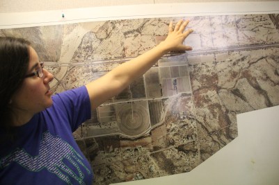 Cie'na Schlaefli, the farm's Propagation Manager, with a map of the farm. Photo by Angelo Baca