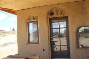 With the help of interns and family members, Lillian and Jacobo are also building a cobb and straw bale home for her mother. The house is built with a passive solar design to cut down on heating costs, and utilizes all local materials, including sand, clay, straw, and local timber from a mill in Flaggstaff. The insualtion for the home is made from sheep wool and recycled denim. Photo by Angelo Baca