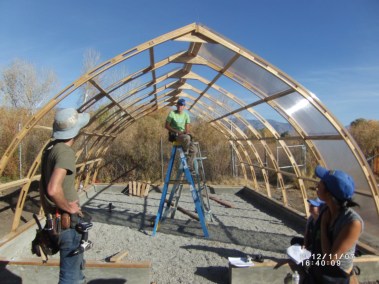 Building the greenhouse frame. Photo by Keith Glidewell
