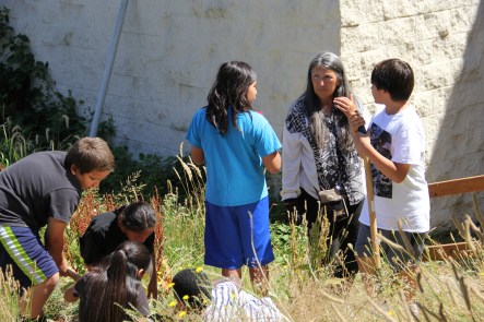 Judy with NAYA youth in the demonstration garden. Photo by Angelo Baca