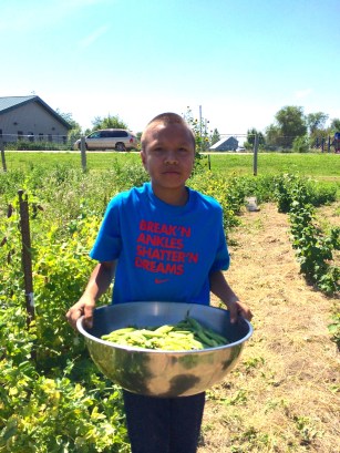 Garden intern Luta, with fresh picked peas