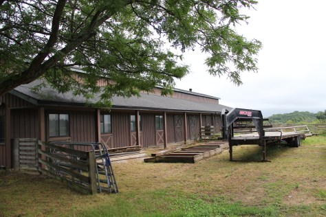 Horse barn that Woody hopes to someday convert to a learning space, including a cannery and vegetable processing station. Photo by Elizabeth Hoover