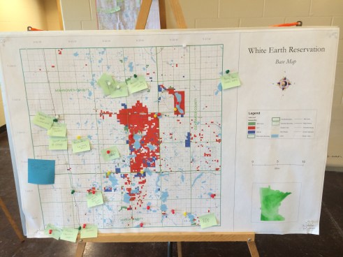 During the foodshed mapping exercise, residents identified food related needs and assets in the community, and represented these through post-it notes on a map of the reservation. The post-its show here represent different food producers that community members can go to. Photo by Elizabeth Hoover