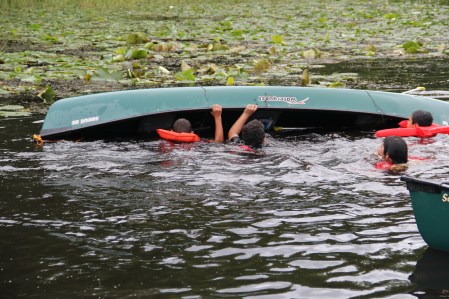 Learning how to right a canoe once it has been tipped. Photo by Angelo Baca