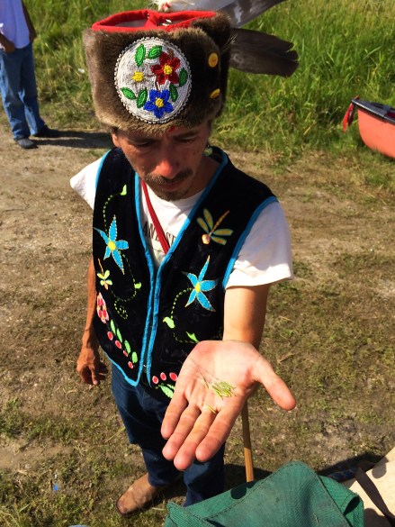 Michael Dahl holding wild rice that they picked while out on Rice Lake. Photo by Elizabeth Hoover