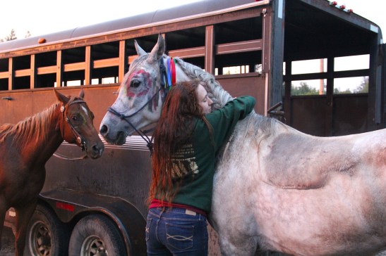 Molly giving Phantom a hug after a long ride. Photo by Elizabeth Hoover