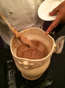 Arlie cooking mush in his new traditionally made pot. Photo by Elizabeth Hoover
