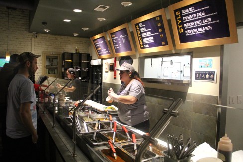 Customers choose a base for their meal: Indian Taco, Stuffed Fry Bread, Medicine Wheel Nacho, or Posu Bowl (wild rice). Then they select a protein: beef, chicken, ground bison, shredded bison, or veggies, and then add toppings, like the restaurant's signature Osage Hominy Salsa. Check out their full menu at http://tocabe.com/index.php/menu/. (Photo by Elizabeth Hoover)