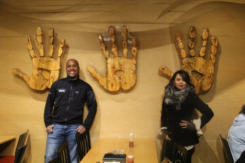 The three hands on the wall are hand carved from beetle kill pines, and represent the three villages of the Osage (Hominy, Gray Horse, and Pawhuska). Photo by Elizabeth Hoover